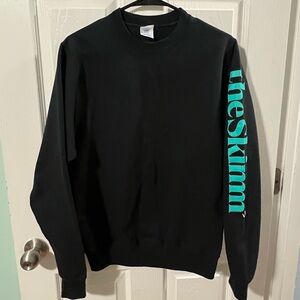 Port and Company Unisex Black Crewneck with Teal Sleeve Logo